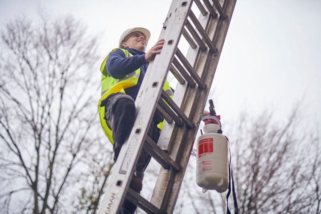 Technician on a ladder