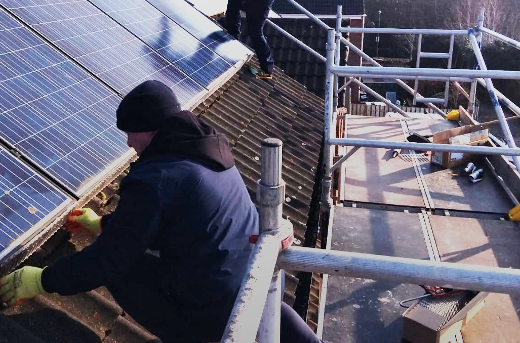 Copley team members installation bird proofing on a roof